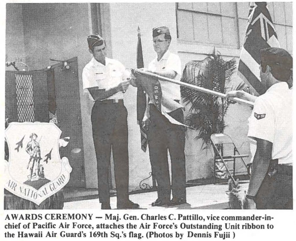 AWARDS CEREMONY - Maj. Gen. Charles C. Pattillo, vice commander-in-chief of Pacific Air Force, attaches the Air Force's Outstanding Unit ribbon to the Hawaii Air Guard's 169th Sq.'s flag. (Photos by Dennis Fujii )