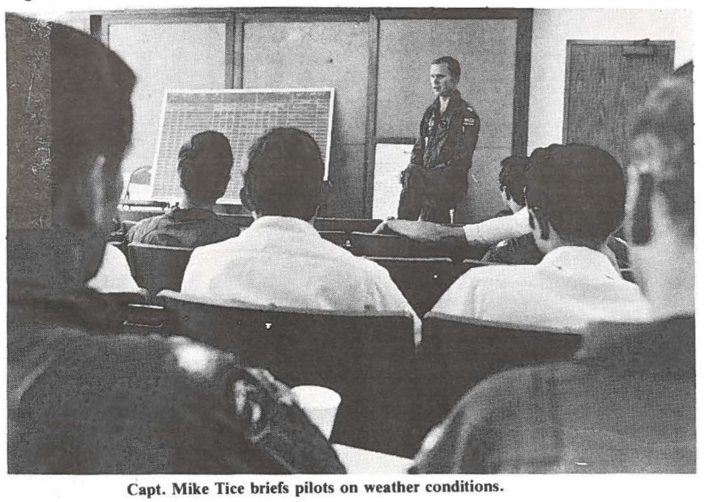 Capt. Mike Tice briefs pilots on weather conditions.