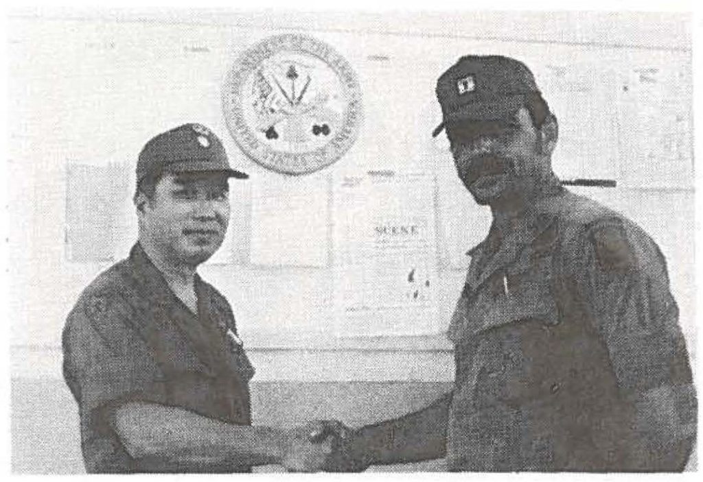 WAILUKll, Maui - Maj. Shigeto (Mustard) Murayama, commander 1st Bn 299th Inf, congratulates Capt. Walter Pierson, newly appointed commander of Company C. Capt. Pierson, a black belt Karate instructor, replaces Capt. Glenn Perry. Maui Army Guard Photo