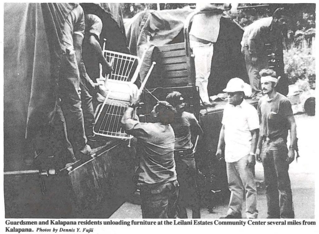 Guardsmen and Kalapana residents unloading furniture at the Leilani Estates Community Center several miles from Kalapana. Pholos by Dennis Y. Fujii