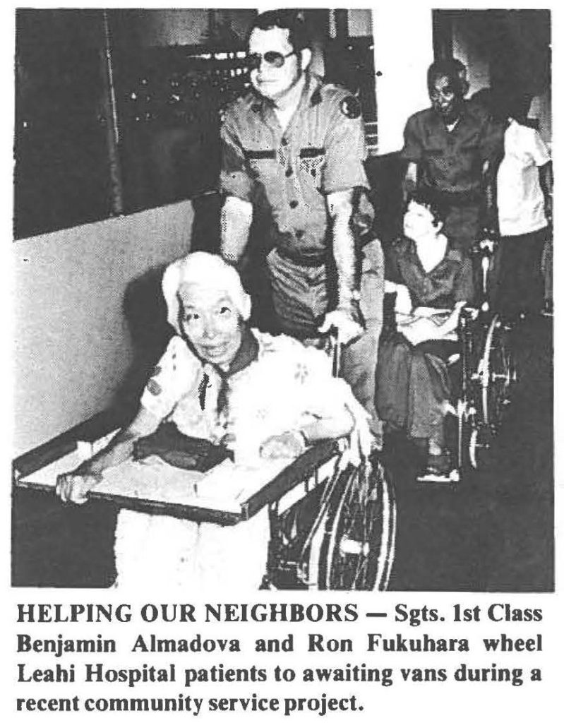 HELPING OUR NEIGHBORS - Sgts. 1st Class Benjamin Almadova and Ron Fukuhara wheel Leahi Hospital patients to awaiting vans during a recent community service project.