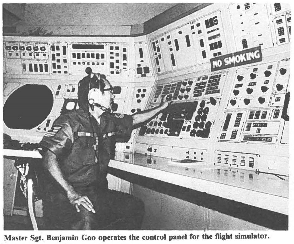 Master Sgt. Benjamin Goo operates the control panel for the flight simulator.