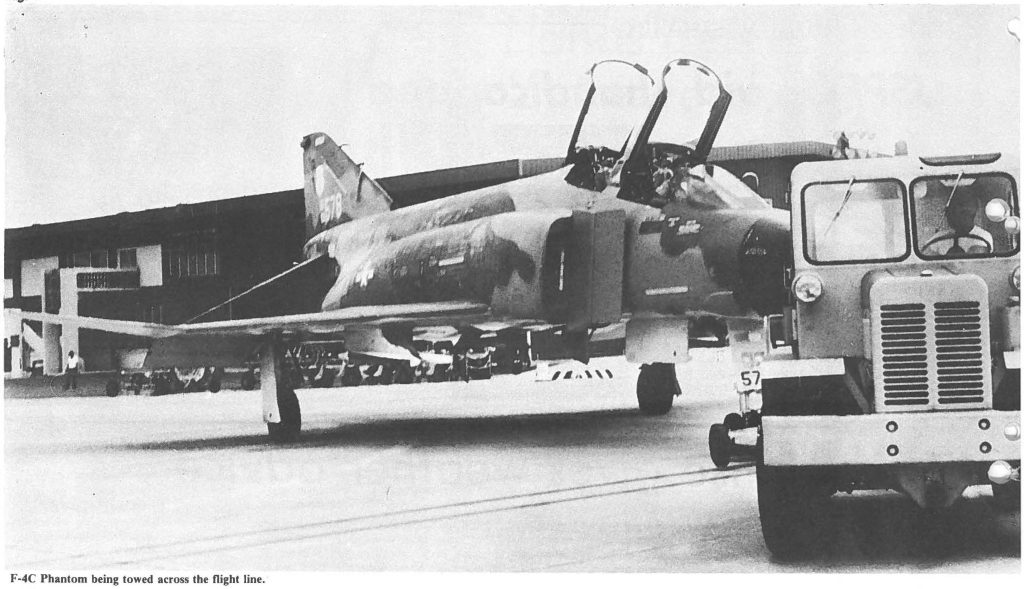 F-4C Phantom being towed across the flight line.