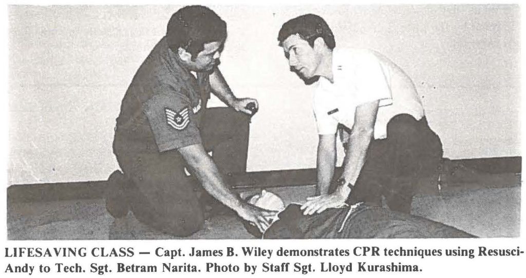 LIFESAVING CLASS - Capt. James 8. Wiley demonstrates CPR techniques using ResusciAndy to Tech. Sgt. Betram Narita. Photo by Staff Sgt. Lloyd Kurashima.