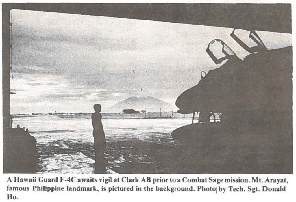 A Hawaii Guard F-4C awaits vigil at Clark AB prior to a Combat Sage mission. Mt. Arayat, famous Philippine landmark, is pictured in the background. Photo by Tech. Sgt. Donald Ho.