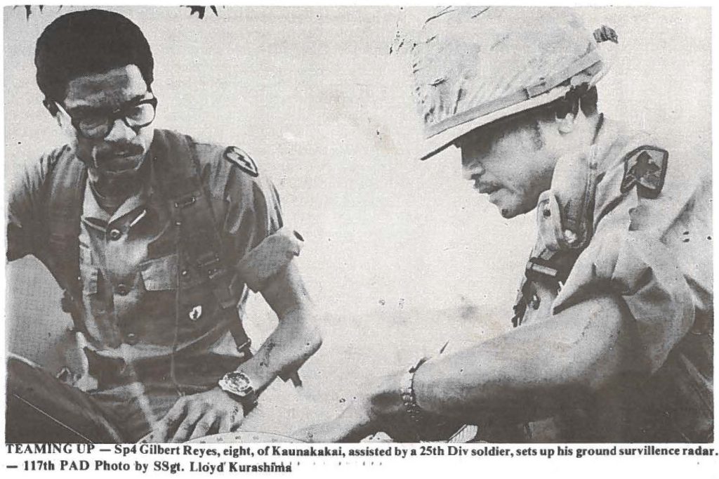 TEAMING UP - Sp4 Gilbert Reyes, eight, of Kaunakakai, assisted by a 25th Div soldier, sets up his ground surveillance radar. - 117th PAD Photo by SSgt. Lloyd Kurashima