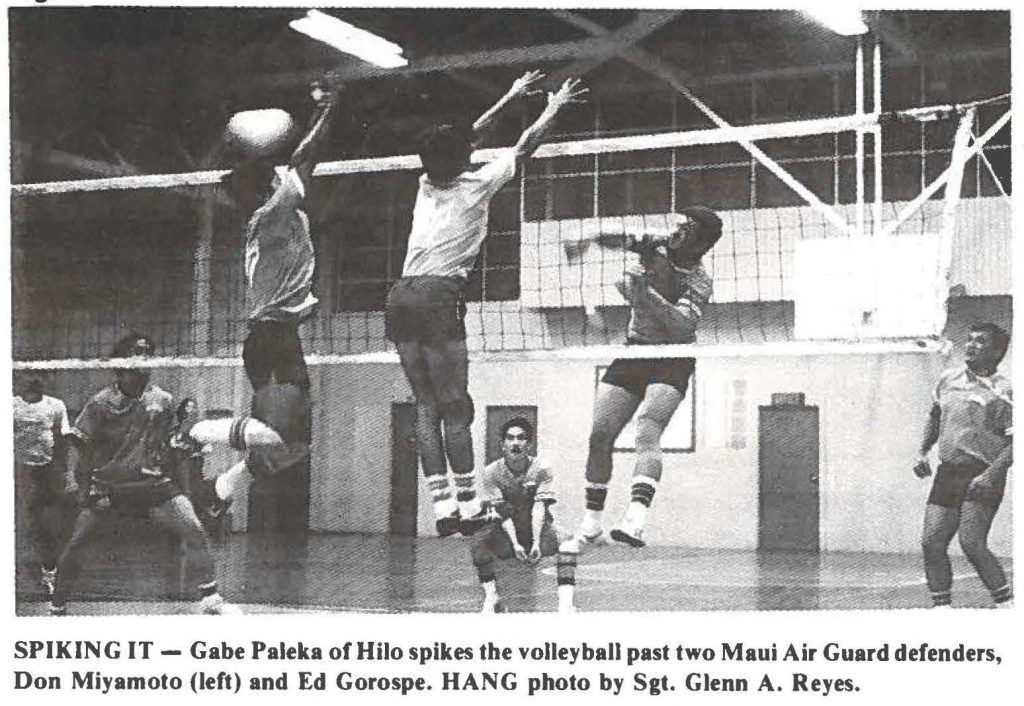 SPIKING IT - Gabe Paleka of Hilo spikes the volleyball past two Maui Air Guard defenders, Don Miyamoto (left) and Ed Gorospe. HANG photo by Sgt. Glenn A. Reyes.