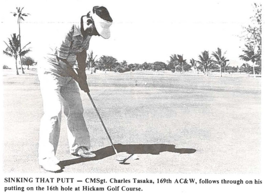 SINKING THAT PUTT - CMSgt. Charles Tasaka, 169th AC&W, follows through on his putting on the 16th hole at Hickam Golf Course.