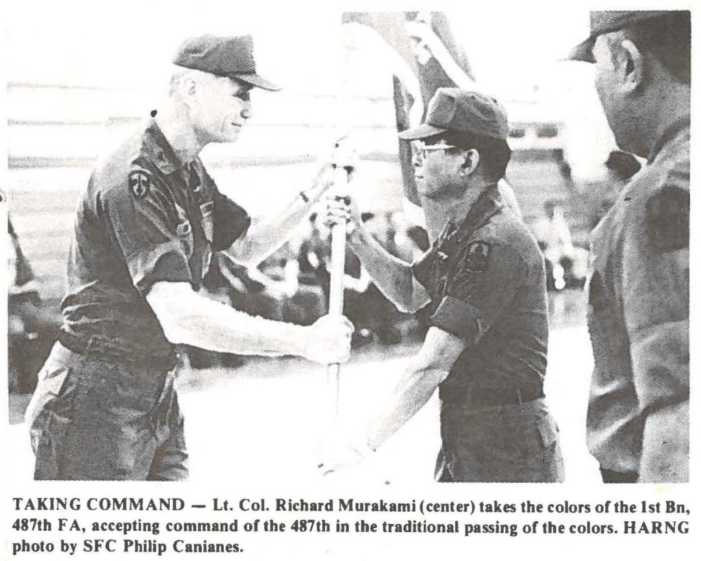 TAKING COMMAND - Lt. Col. Richard Murakami (center) takes the colors of the 1st Bn, 487th FA, accepting command of the 487th in the traditional passing of the colors. HARNG photo by SFC Philip Canianes.