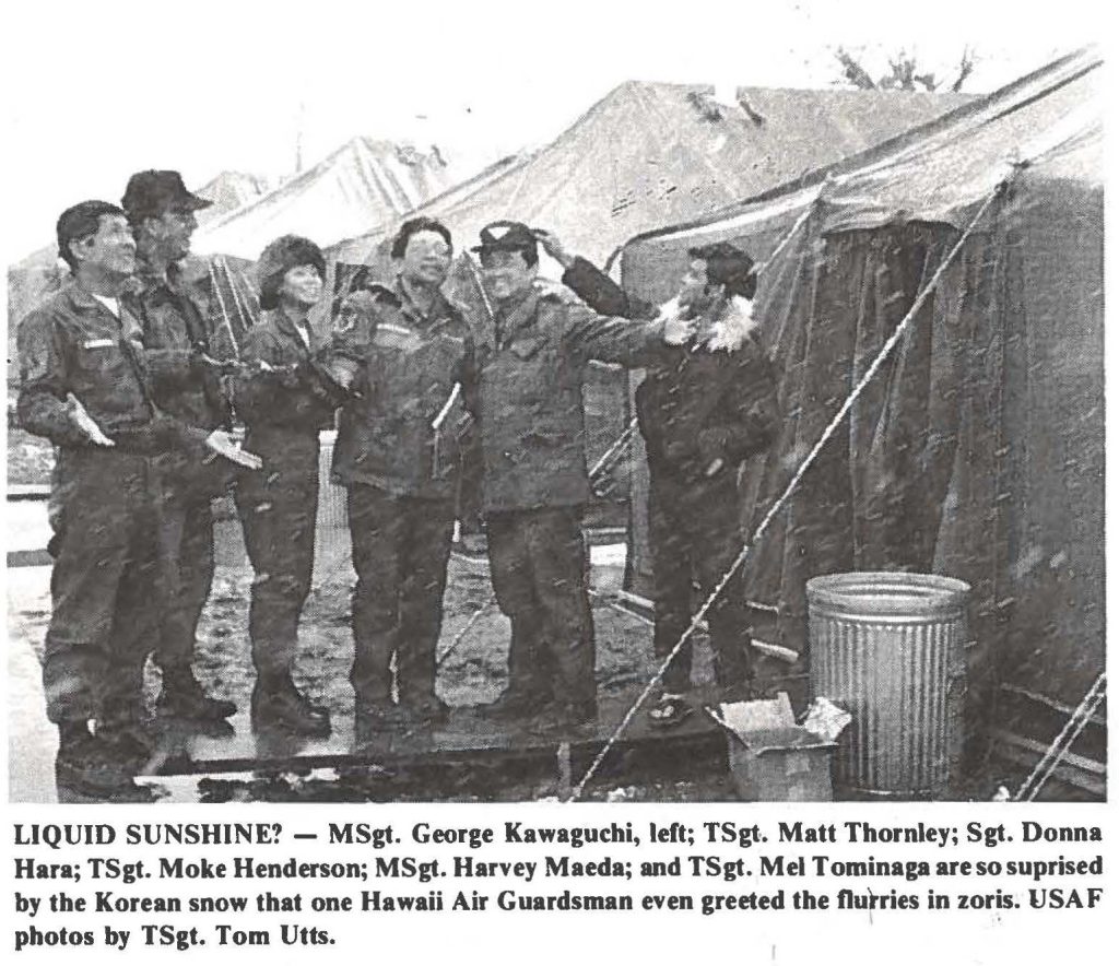 LIQUID SUNSHINE? - MSgt. George Kawaguchi, left; TSgt. Matt Thornley; Sgt. Donna Hara; TSgt. Moke Henderson; MSgt. Harvey Maeda; and TSgt. Mel Tominaga are so suprised by the Korean snow that one Hawaii Air Guardsman even greeted the flurries in zoris. USAF photos by TSgt. Tom Utts.