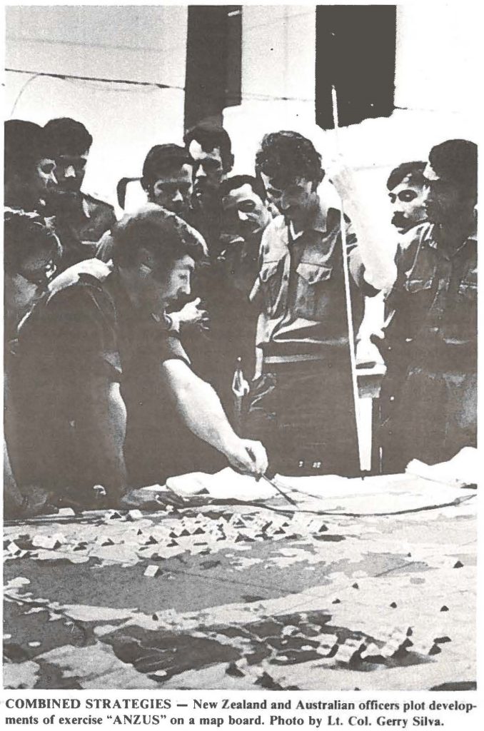 COMBINED STRATEGIES - New Zealand and Australian officers plot developments of exercise "ANZUS" on a map board. Photo by Lt. Col. Gerry Silva.