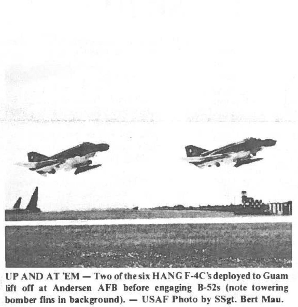 UP AND AT 'EM - Two of the six HANG F-4C's deployed to Guam lift off at Andersen AFB before engaging B-52s (note towering bomber fins in background). - USAF Photo by SSgt. Bert Mau.