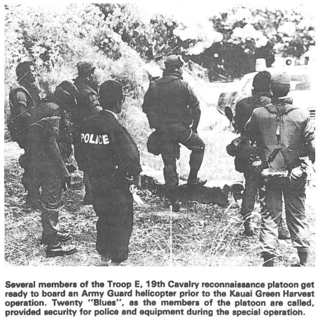 Several members of the Troop E. 19th Cavalry reconnaissance platoon get ready to board an Army Guard helicopter prior to the Kauai Green Harvest operation. Twenty "Blues", as the members of the platoon are called, provided security for police and equipment during the special operation.