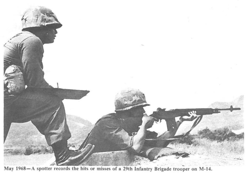 May 1968-A spotter records the hits or misses of a 29th Infantry Brigade trooper on M-14.