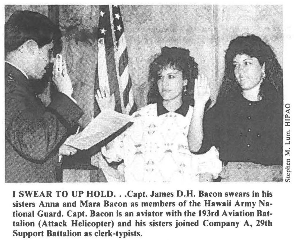 I SWEAR TO UP HOLD . . . Capt. James D.H. Bacon swears in his sisters Anna and Mara Bacon as members of the Hawaii Army National Guard. Capt. Bacon is an aviator with the 193rd Aviation Battalion (Attack Helicopter) and his sisters joined Company A, 29th Support Battalion as clerk-typists.