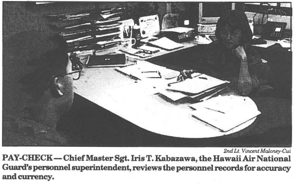 PAY-CHECK-Chief Master Sgt. Iris T. Kabazawa, the Hawaii Air National Guard's personnel superintendent, reviews the personnel records for accuracy and currency.