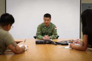 A Soldier from The Singapore Armed Forces participates in a simulated media event during Exercise Tiger Balm 24 at Joint Base Lewis-McChord, Washington, May 15, 2024. Tiger Balm consists of several different training events including the command post exercise, field training exercise and subject matter expert exchanges. (U.S. Army National Guard photo by 1st Lt. TeAta H. Gutierrez)