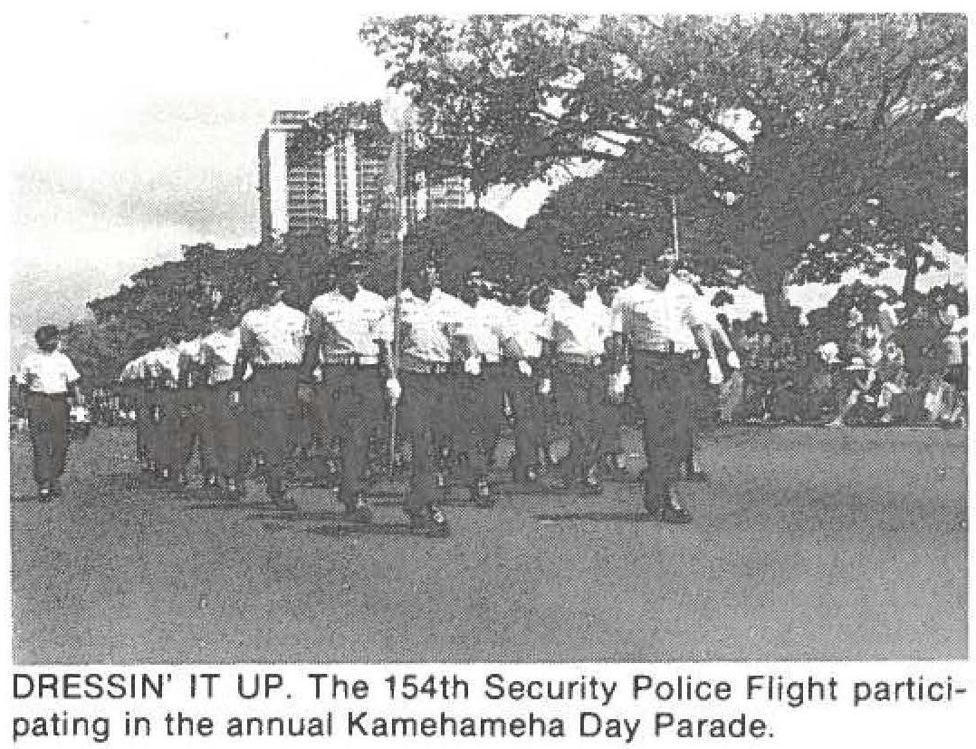 DRESSIN' IT UP. The 154th Security Police Flight participating in the annual Kamehameha Day Parade.