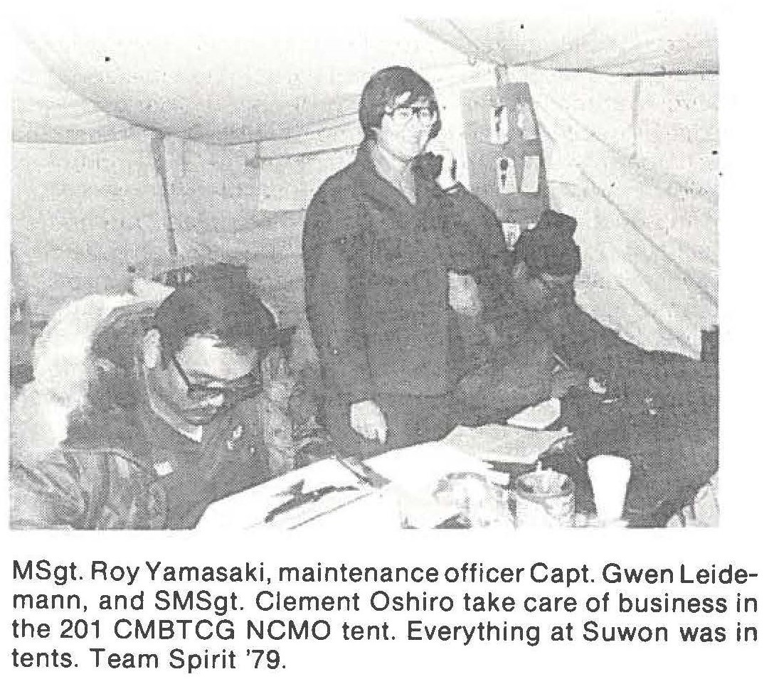 MSgt. Roy Yamasaki, maintenance officer Capt. Gwen Leidemann, and SMSgt. Clement Oshiro take care of business in the 201 CMBTCG NCMO tent. Everything at Suwon was in tents. Team Spirit '79.