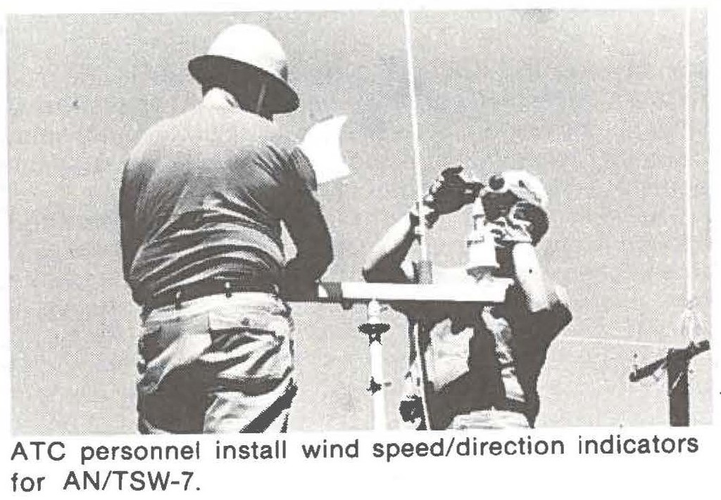 ATC personnel install wind speed/direction indicators for AN/TSW-7.