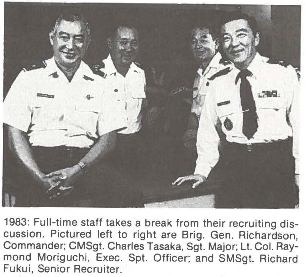 1983: Full-time staff takes a break from their recruiting discussion. Pictured left to right are Brig. Gen. Richardson, Commander; CMSgt. Charles Tasaka, Sgt. Major; Lt. Col. Raymond Moriguchi , Exec. Spt. Officer; and SMSgt. Richard Fukui, Senior Recruiter.