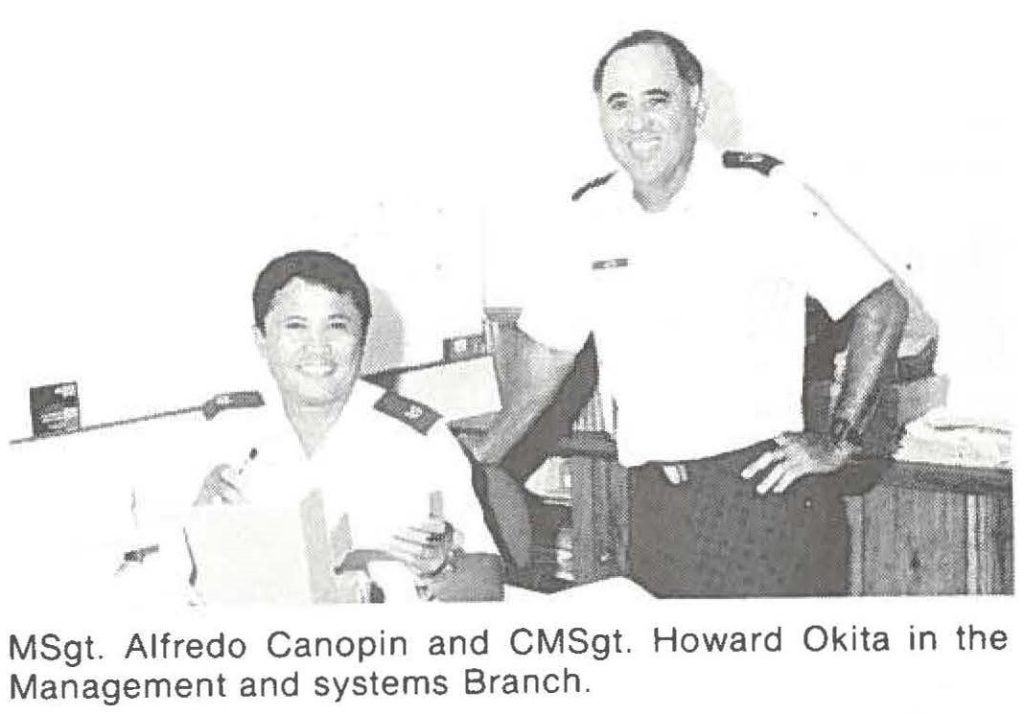 MSgt. Alfredo Canopin and CMSgt. Howard Okita in the Management and systems Branch.