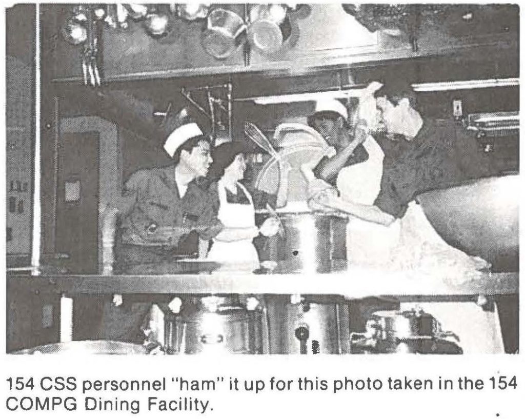 154 CSS personnel "ham" it up for this photo taken in the 154 COMPG Dining Facility.