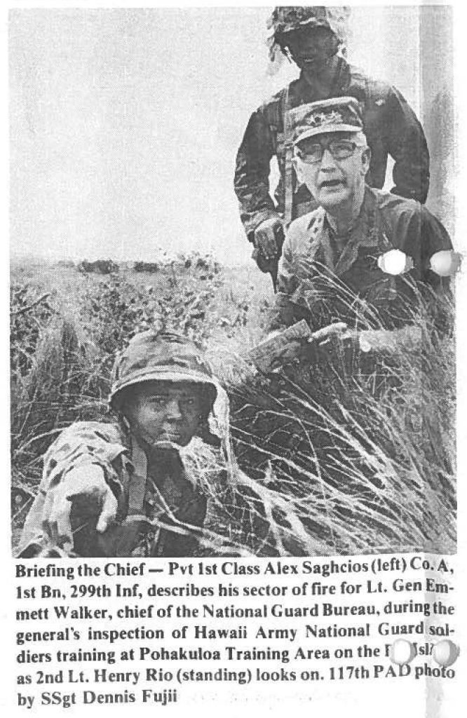 Briefing the Chief - Pvt 1st Class Alex Saghcios (left) Co. A. 1st Bn, 299th Inf, describes his sector of fire for Lt. Gen Emmett Walker, chid of the National Guard Bureau, during the general's inspection of Hawaii Army National Guard soldiers training at Pohakuloa Training Area on the Big Island as 2nd Lt. Henry Rio (standing) looks on. 117th PA photo by SSgt Dennis Fujii