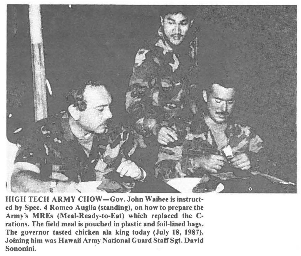 HIGH TECH ARMY ' CHOW-Gov. John Waihee is instructed by Spec. 4 Romeo Auglia (standing), on how to prepare the Army's MREs (Meal-Ready-to-Eat) which replaced the C-rations. The field meal is pouched in plastic and foil-lined bags. The governor tasted chicken ala king today (July 18, 1987). Joining him was Hawaii Army National Guard Staff Sgt. David Sononini.