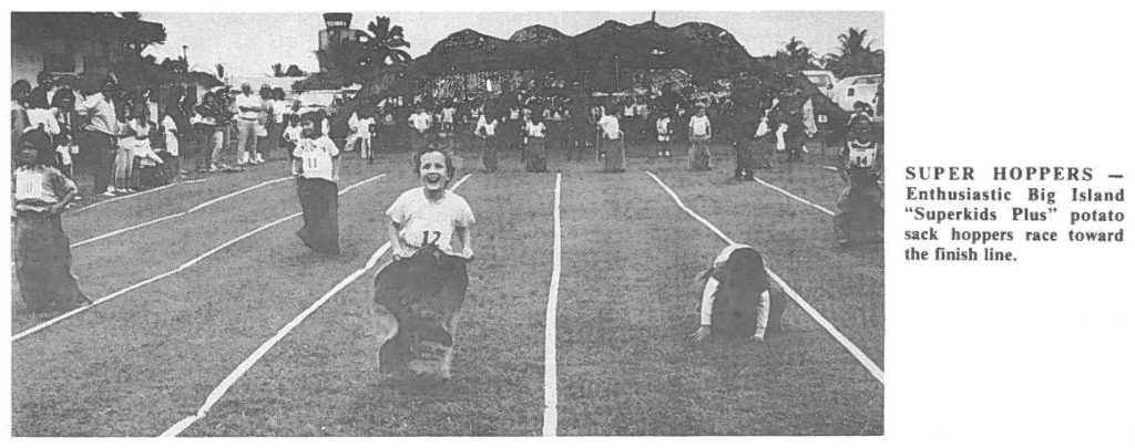 SUPER HOPPERS - Enthusiastic Big Island "Superkids Plus" potato sack hoppers race toward the finish line