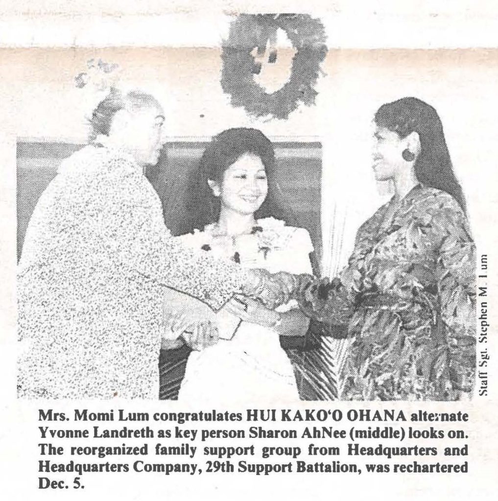 Mrs. Momi Lum congratulates HUI KAKO'O OHANA alternate Yvonne Landreth as key person Sharon AhNee (middle) looks on. The reorganized family support group from Headquarters and Headquarters Company, 29th Support Battalion, was rechartered Dec. 5.