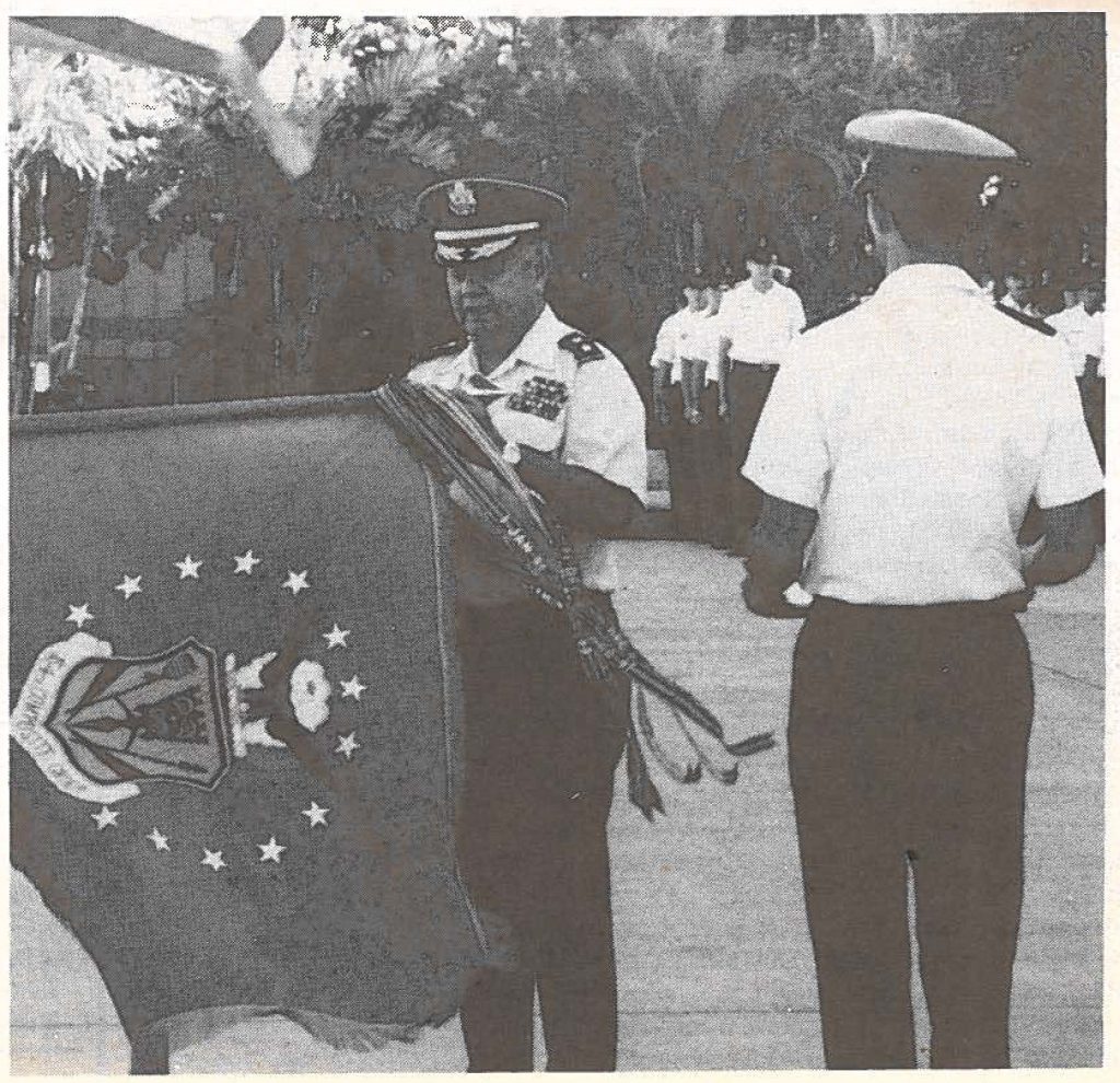 Maj. Gen. Alexis T. Lum, state adjutant general, places the fifth Outstanding Unit Award streamer on the 154th Composite Group's colors, Feb. 4. The Hawaii Air National Guard unit received the award from the U.S. Air Force at ceremonies held at their Hickam Air Force Base facility.