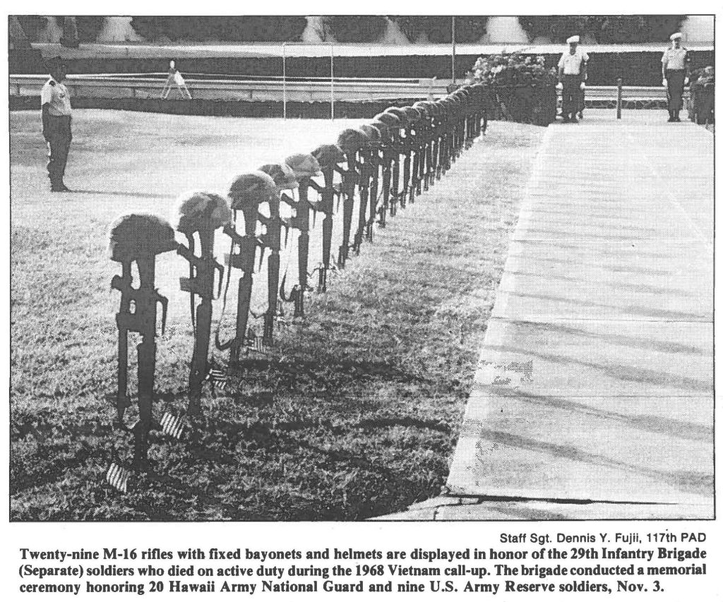 Twenty-nine M-16 rifles with fixed bayonets and helmets are displayed in honor of the 29th Infantry Brigade (Separate) soldiers who died on active duty during the 1968 Vietnam call-up. The brigade conducted a memorial ceremony honoring 20 Hawaii Army National Guard and nine U.S. Army Reserve soldiers, Nov. 3