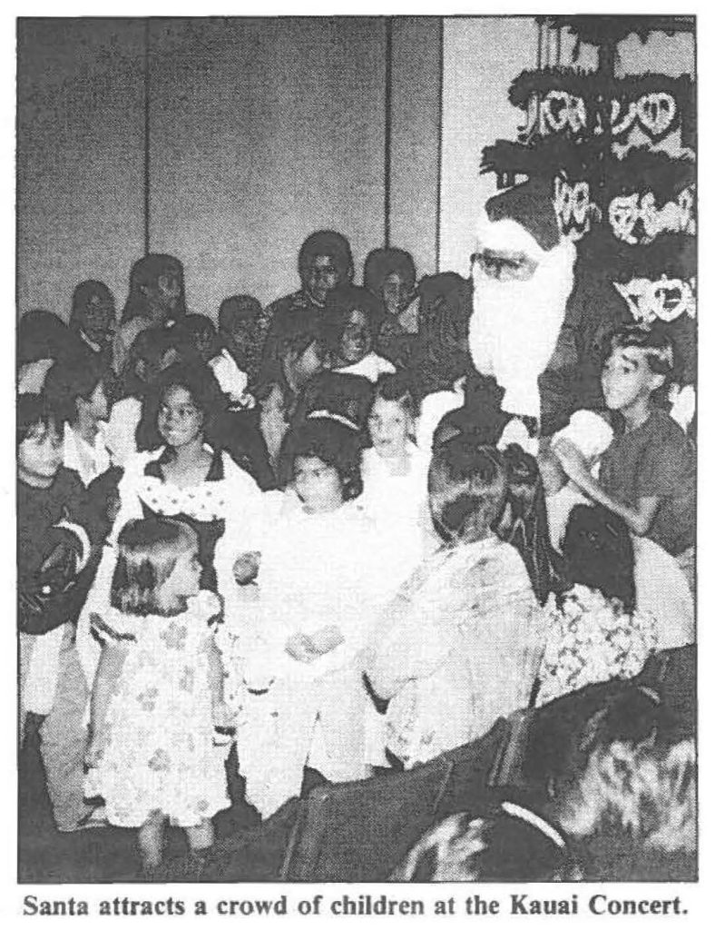 Santa attracts a crowd of children at the Kauai Concert.