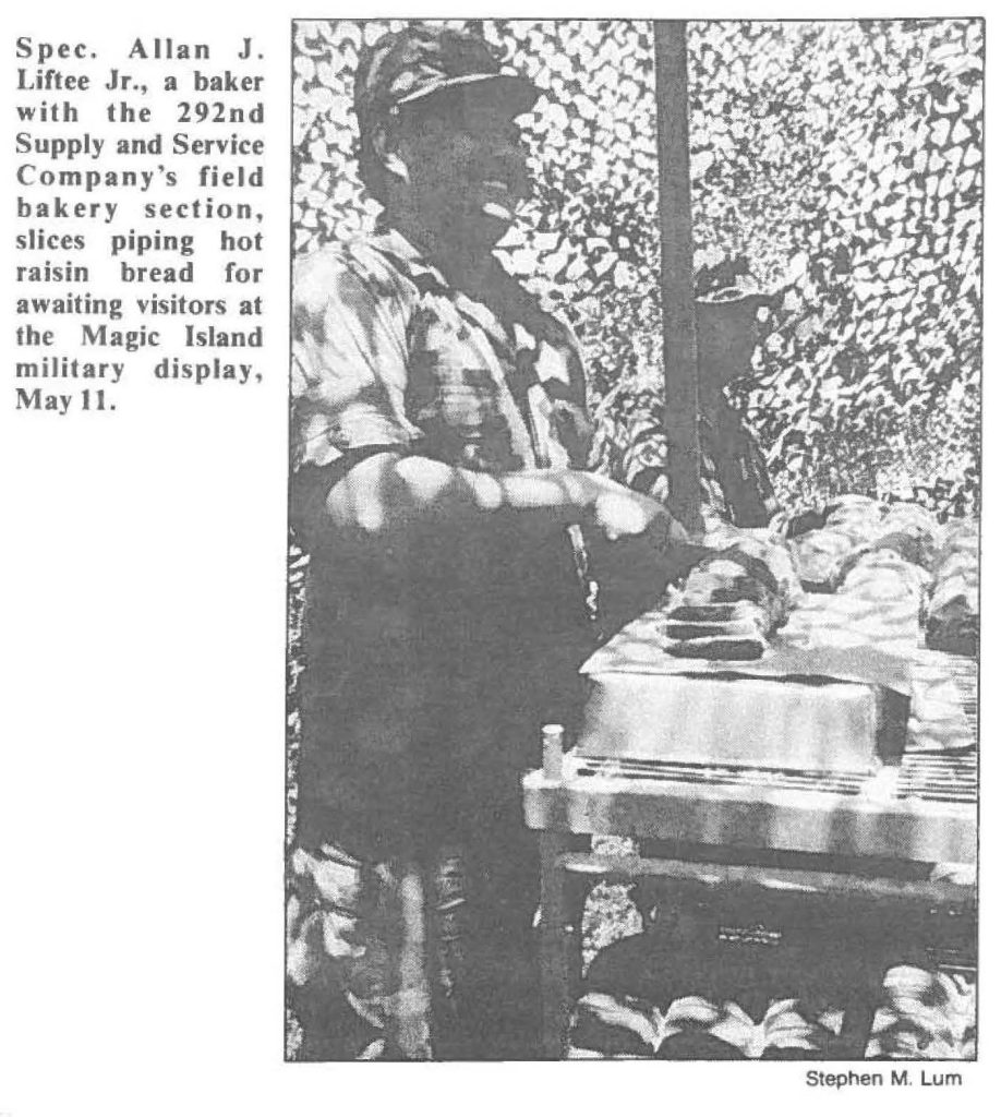 Spec. Allan J. Liftee Jr., a baker with the 292nd Supply and Service Company's field bakery section, slices piping hot raisin bread for awaiting visitors at the Magic Island military display, May II.