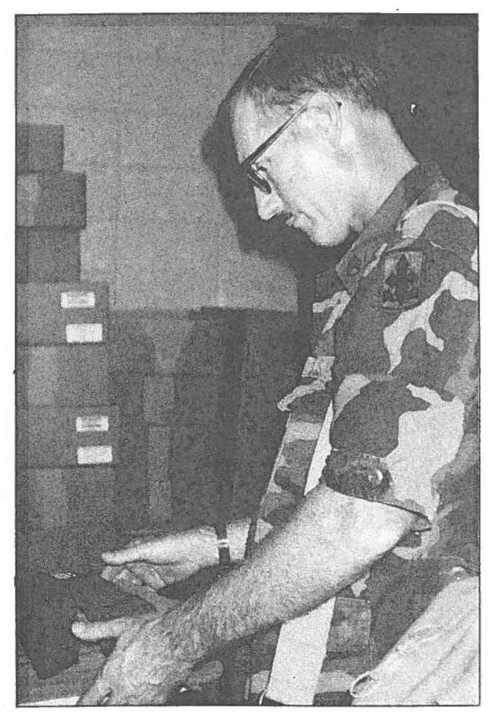 Staff Sgt. Robert D. Mumby is issued towels, socks, and other supplies at Fort Dix, N.J.