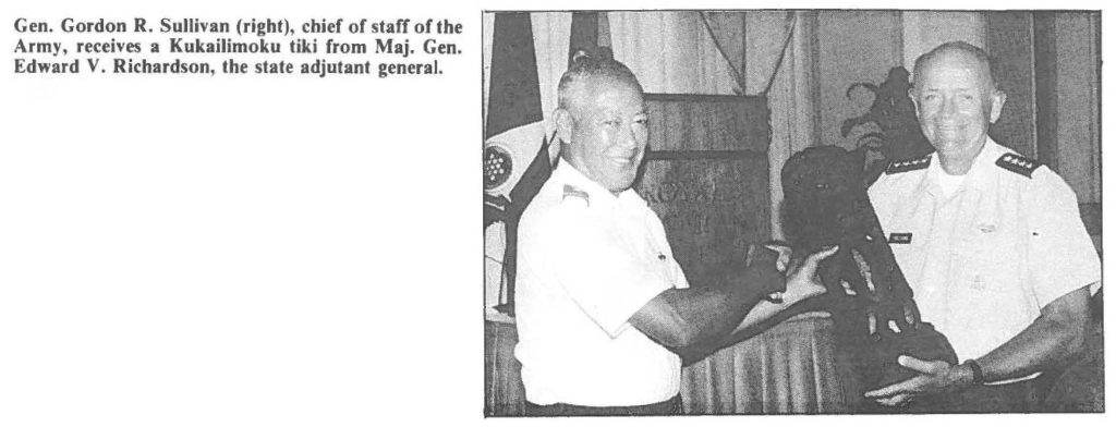 Gen. Gordon R. Sullivan (right), chief of staff of the Army, receives a Kukailimoku tiki from Maj. Gen. Edward V. Richardson, the state adjutant general.