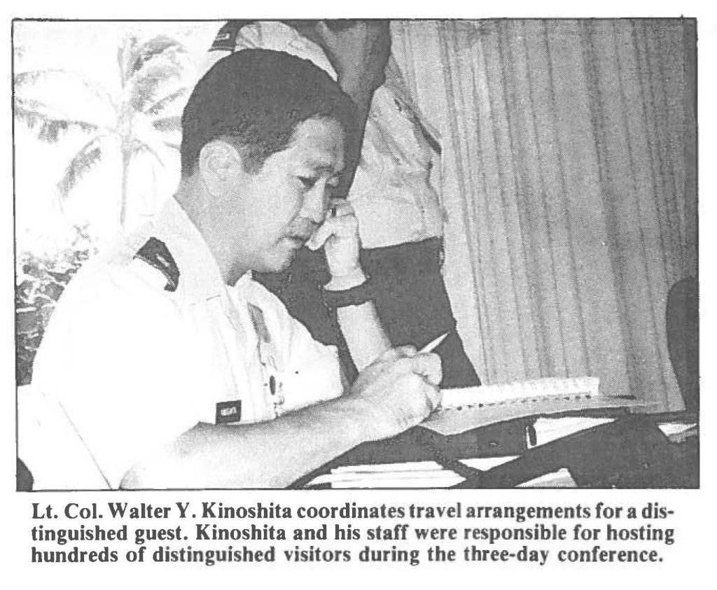 Lt. Col. Walter Y. Kinoshita coordinates travel arrangements for a distinguished guest. Kinoshita and his staff were responsible for hosting hundreds of distinguished visitors during the three-day conference.