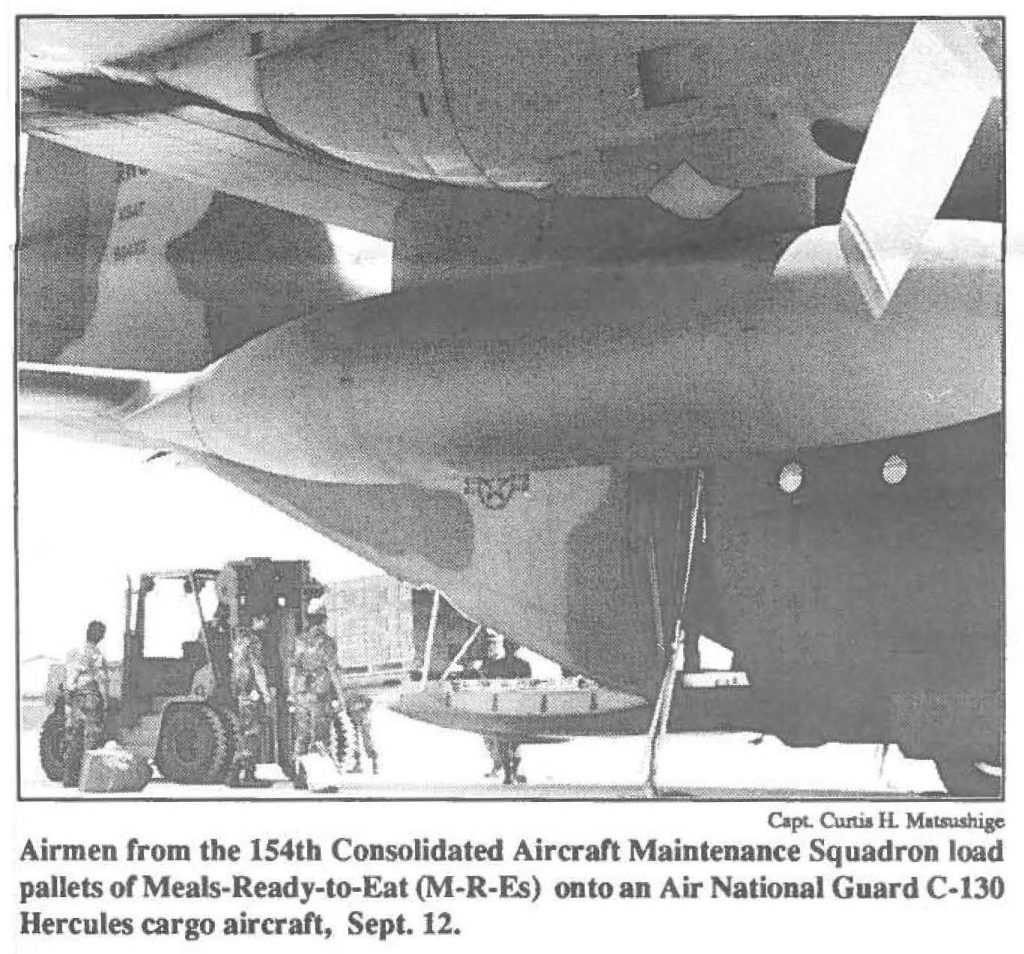 Airmen from the 154th Consolidated Aircraft Maintenance Squadron load pallets of Meals-Ready-to-Eat (M-R-Fs) onto an Air National Guard C-130 Hercules cargo aircraft, Sept. 12.