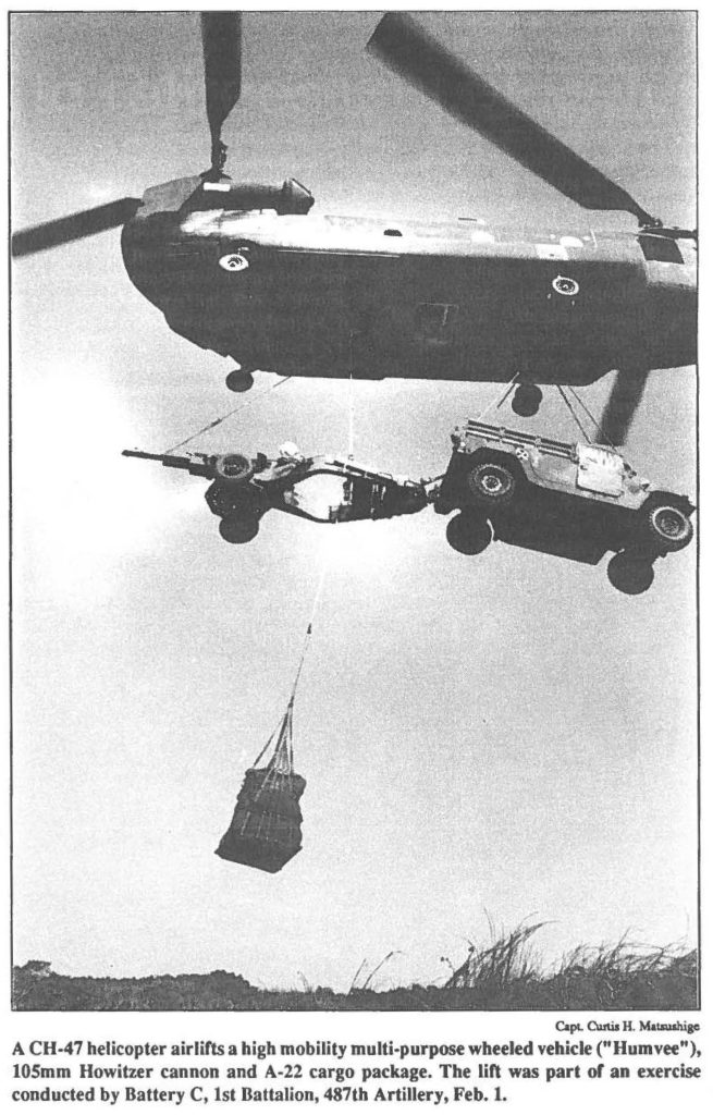 A CH-47 helicopter airlifts a high mobility multi-purpose wheeled vehicle ("Humvee"), 105mm Howitzer cannon and A-22 cargo package. The lift was part or an exercise conducted by Battery C, 1st Battalion, 487th Artillery, Feb. 1.