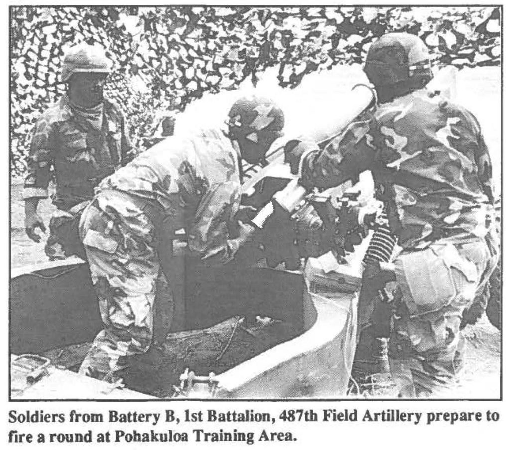 Soldiers from Battery B, 1st Battalion, 487th Field Artillery prepare to fire a round at Pohakuloa Training Area.
