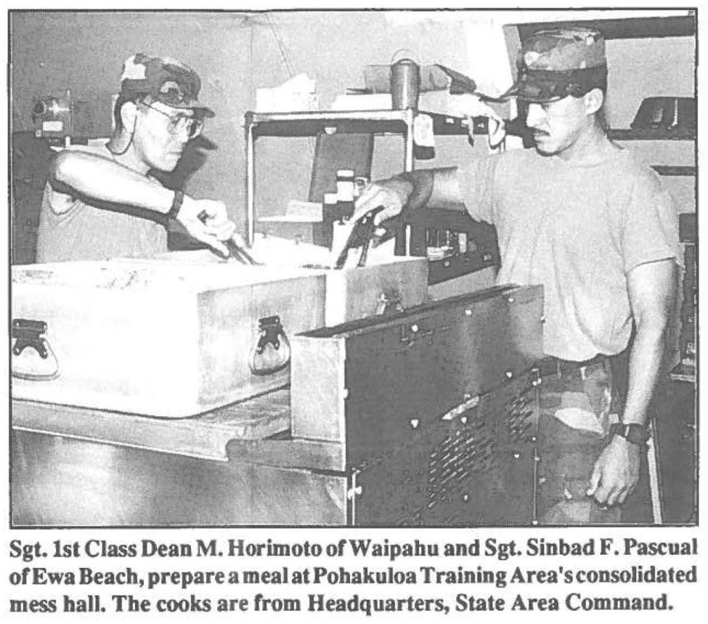 Sgt. 1st Class Dean M. Horimoto of Waipahu and Sgt. Sinbad F. Pascual of Ewa Beach, prepare a meal at Pohakuloa Training Area's consolidated mess hall. The cooks are from Headquarters, State Area Command.
