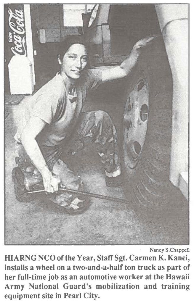 HIARNG NCO of the Year, Staff Sgt. Carmen K. Kanei, installs a wheel on a two-and-a-half ton truck as part of her full-time job as an automotive worker at the Hawaii Army National Guard's mobilization and training equipment site in Pearl City