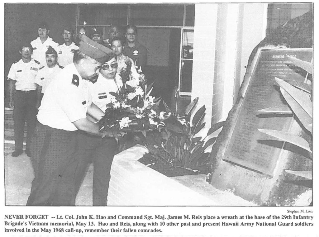 NEVER FORGET -- Lt. Col. John K. Hao and Command Sgt. Maj. James M. Reis place a wreath at the base of the 29th Infantry Brigade's Vietnam memorial, May 13. Hao and Reis, along with 10 other past and present Hawaii Army National Guard soldiers
involved in the May 1968 call-up, remember their fallen comrades. 