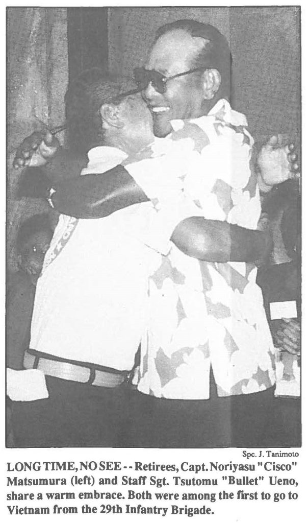 LONG TIME, NO SEE--Retirees, Capt. Noriyasu "Cisco" Matsumura (left) and Staff Sgt. Tsutomu "Bullet" Ueno, share a warm embrace. Both were among the first to go to Vietnam from the 29th Infantry Brigade.