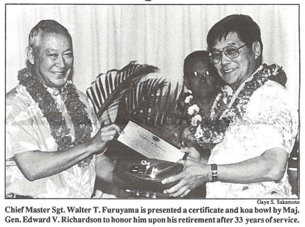 Chief Master Sgt. Walter T. Furuyama is presented a certificate and koa bowl by Maj. Gen. Edward V. Richardson to honor him upon his retirement after 33 years of service.