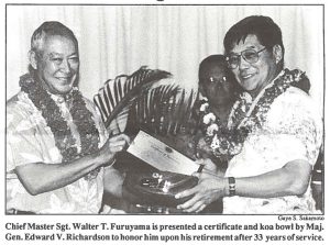 Chief Master Sgt. Walter T. Furuyama is presented a certificate and koa bowl by Maj. Gen. Edward V. Richardson to honor him upon his retirement after 33 years of service.