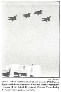 Four F-15s from the Hawaii Air National Guard's 199th Fighter Squadron fly in formation over Kalakaua Avenue to salute the veterans or the 442nd Regimental Combat Team during their anniversary parade, March 27.