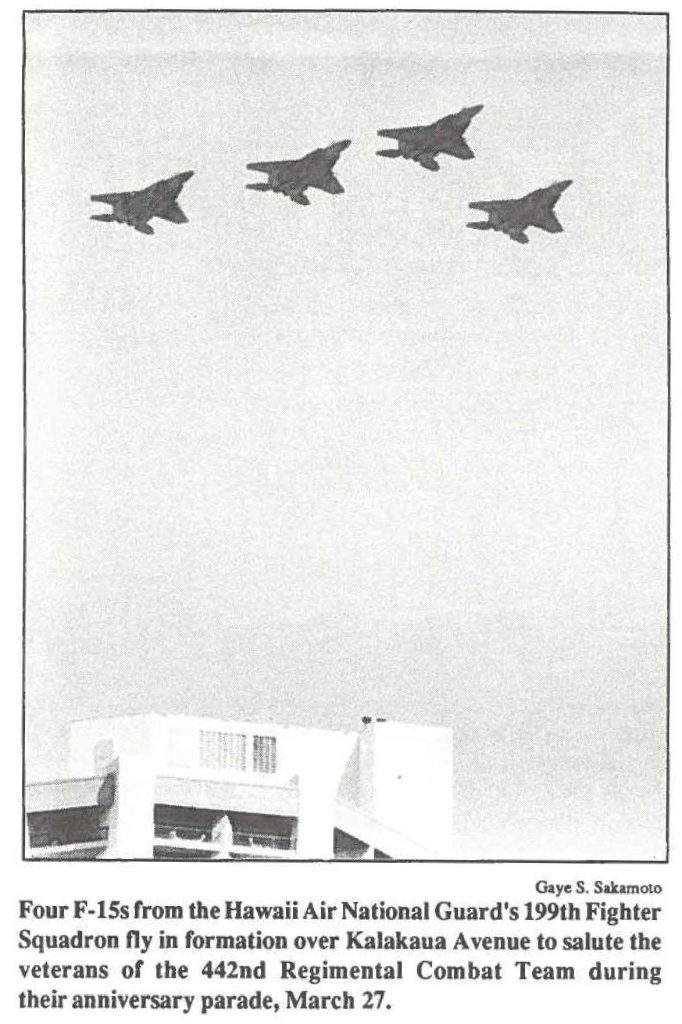Four F-15s from the Hawaii Air National Guard's 199th Fighter Squadron fly in formation over Kalakaua Avenue to salute the veterans or the 442nd Regimental Combat Team during their anniversary parade, March 27.