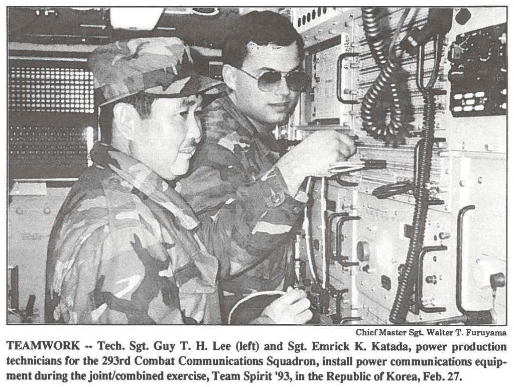 TEAMWORK -- Tech. Sgt. Guy T. H. Lee (left) and Sgt. Emrick K. Katada, power production technicians for the 293rd Combat Communications Squadron, install power communications equipment during the joint/combined exercise, Team Spirit '93, in the Republic of Korea, Feb. 27.